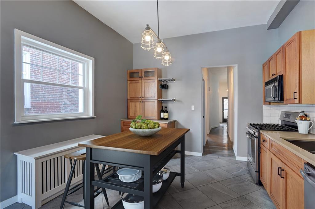 315 Main Street Pittsburgh, PA 15201 - Photo 9 of 23 a kitchen with sink cabinets and dining table