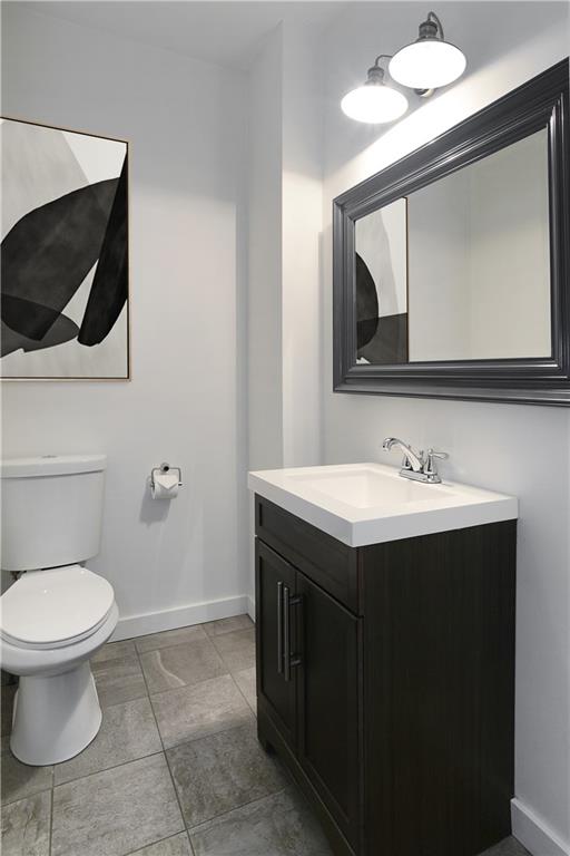 315 Main Street Pittsburgh, PA 15201 - Photo 10 of 23 a bathroom with a sink mirror and toilet