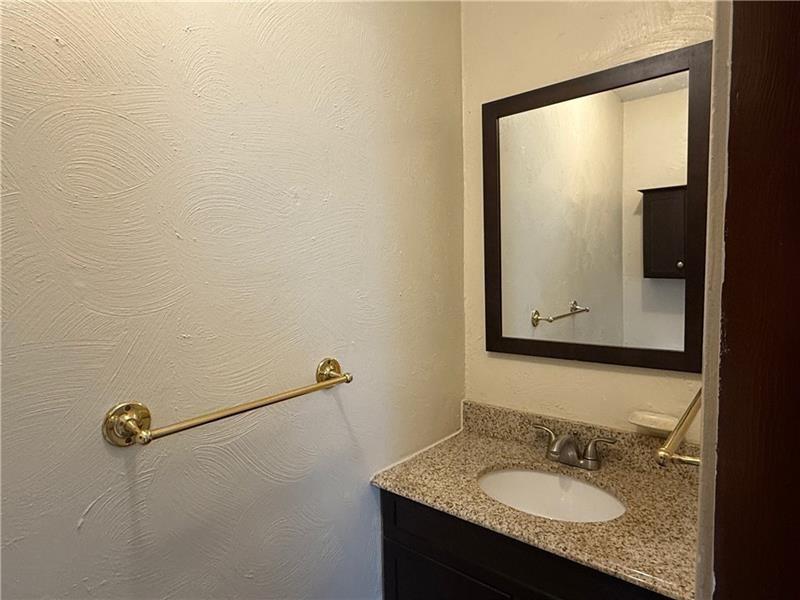 3922 Anderson Road Gibsonia, PA 15044 - Photo 14 of 23 a bathroom with a granite countertop sink and mirror