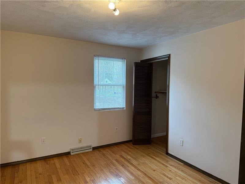 3922 Anderson Road Gibsonia, PA 15044 - Photo 16 of 23 an empty room with wooden floor and windows