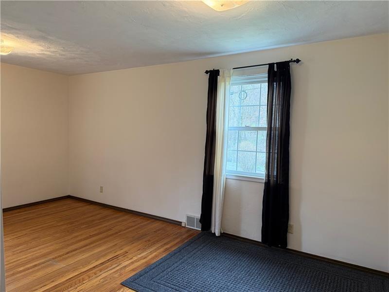 3922 Anderson Road Gibsonia, PA 15044 - Photo 17 of 23 a view of empty room with wooden floor and fan