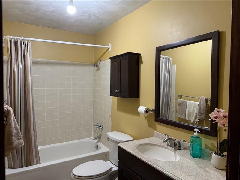 3922 Anderson Road Gibsonia, PA 15044 - Photo 19 of 23 a bathroom with a granite countertop sink toilet and shower