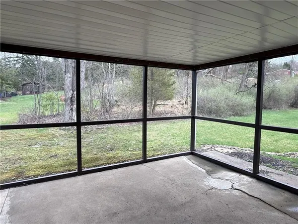 a view of a room with large windows