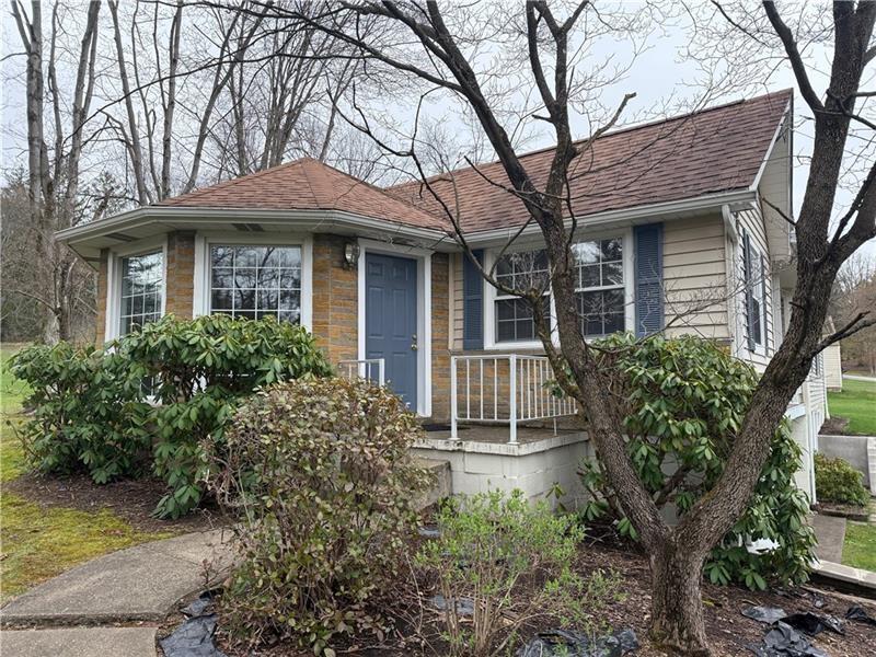 3922 Anderson Road Gibsonia, PA 15044 - Photo 2 of 23 a front view of a house with garden