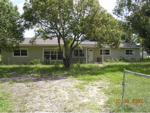 2536 Friday Cocoa, FL 32926 - Photo 1 of 12 a front view of house with yard and green space