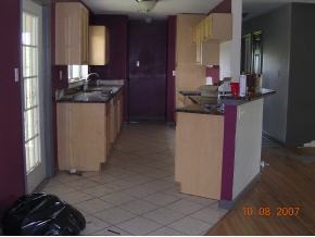 2536 Friday Cocoa, FL 32926 - Photo 3 of 12 a kitchen with refrigerator and cabinets