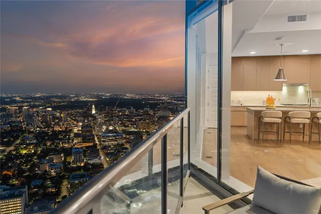 a bathroom with a double vanity sink toilet mirror and bathtub