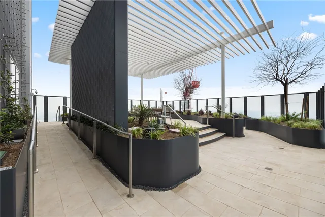 a living room with furniture and floor to ceiling window