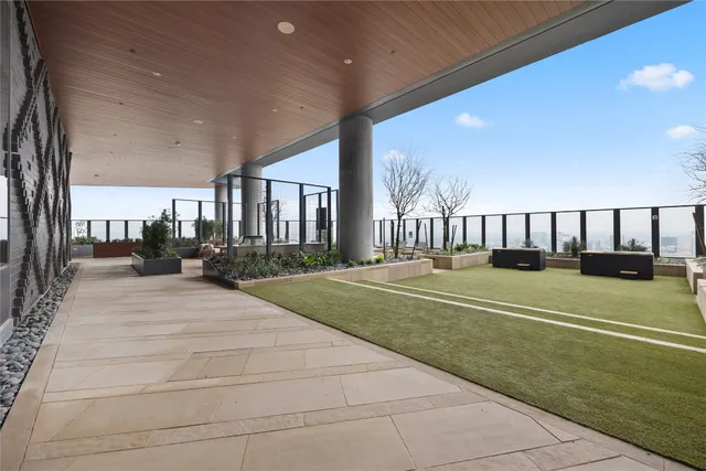 a view of a terrace with furniture and a backyard