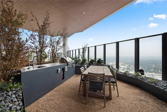 a view of a patio with couches chairs and potted plants