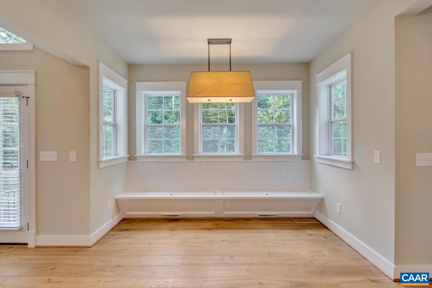 1508 Grove Road Charlottesville, VA 22901 - Photo 16 of 69 a view of an empty room with wooden floor and a window