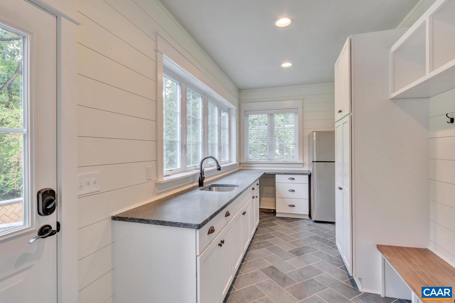 1508 Grove Road Charlottesville, VA 22901 - Photo 18 of 69 a bathroom with a granite countertop sink mirror and a bathtub