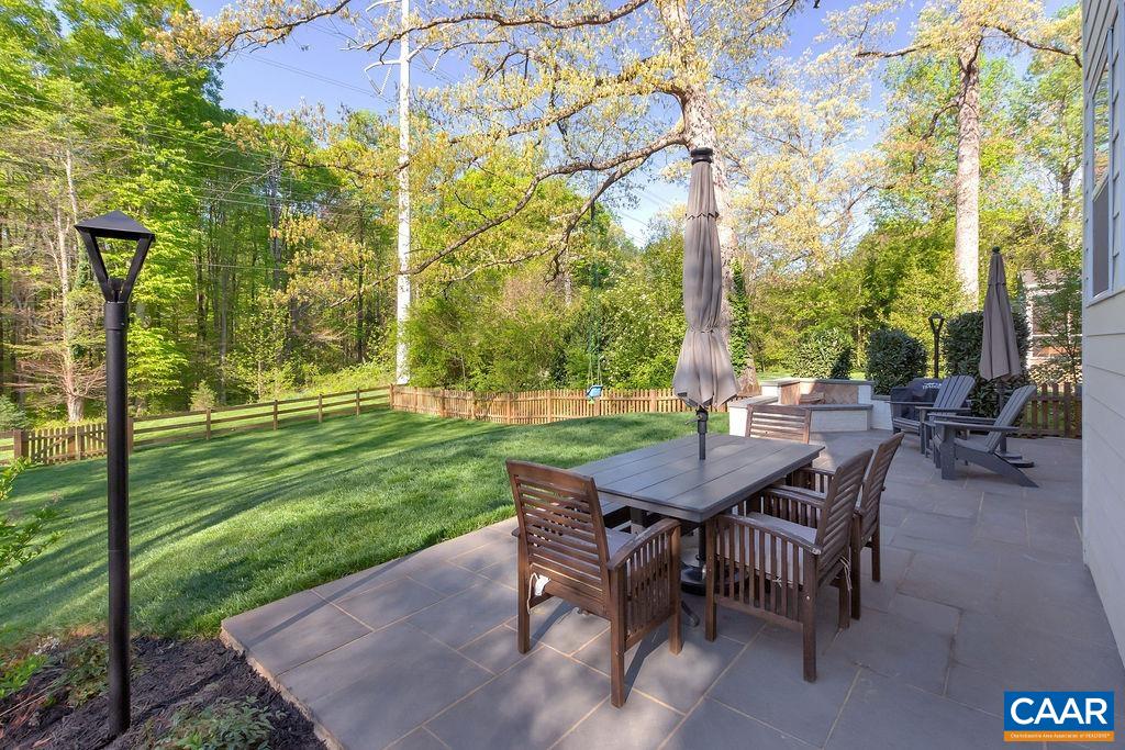 1508 Grove Road Charlottesville, VA 22901 - Photo 54 of 69 a backyard of a house with a garden and outdoor seating