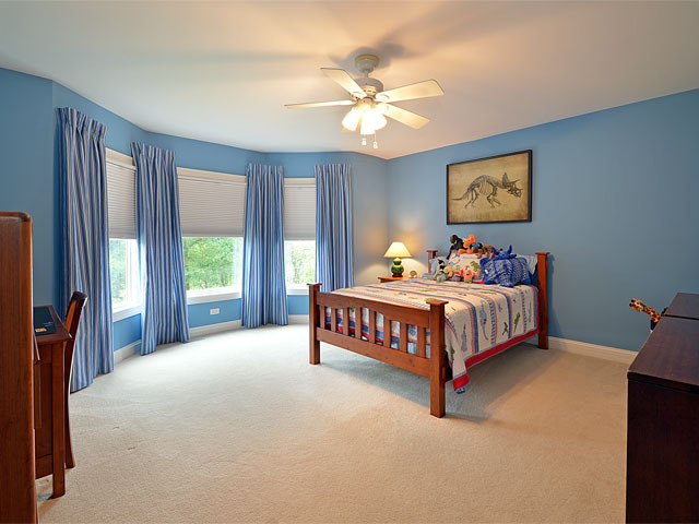 1260 Aberdeen Road Inverness, IL 60067 - Photo 14 of 23 a bedroom with a bed and a chandelier