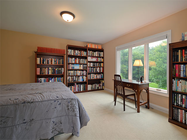 1260 Aberdeen Road Inverness, IL 60067 - Photo 15 of 23 a spacious bedroom with a large bed and a book shelf