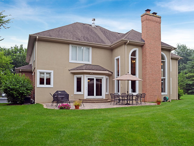 1260 Aberdeen Road Inverness, IL 60067 - Photo 20 of 23 a front view of a house with a garden and plants