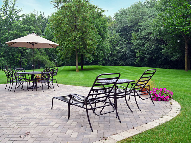 1260 Aberdeen Road Inverness, IL 60067 - Photo 21 of 23 a view of a backyard with a patio and a garden