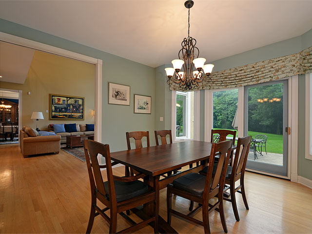 1260 Aberdeen Road Inverness, IL 60067 - Photo 6 of 23 a view of a dining room with furniture wooden floor and chandelier