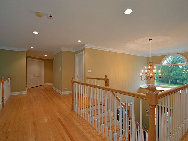 1260 Aberdeen Road Inverness, IL 60067 - Photo 10 of 23 a view of a hallway with a chandelier
