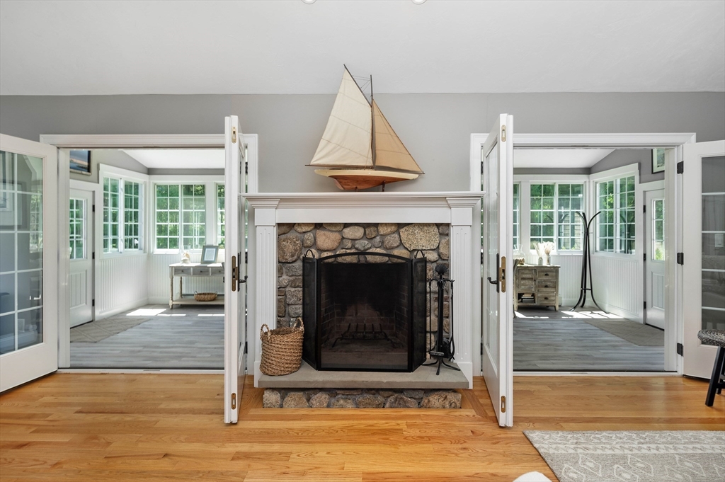 57 Wright's Way Marshfield, MA 02050 - Photo 12 of 35 a living room with a fireplace and a fireplace