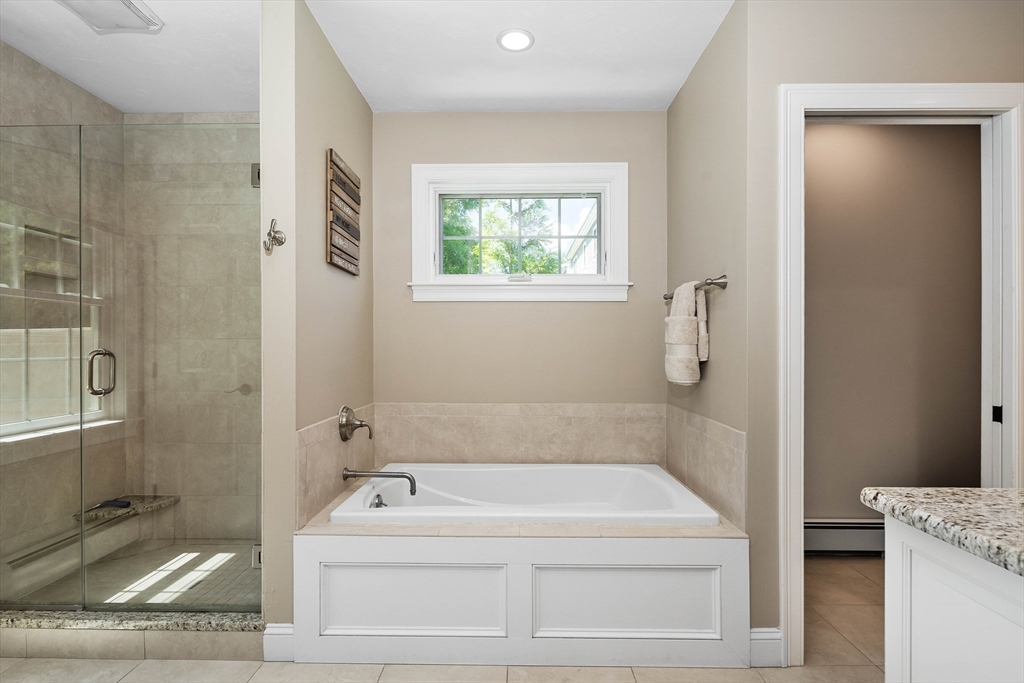 57 Wright's Way Marshfield, MA 02050 - Photo 18 of 35 a bathroom with a bathtub and shower