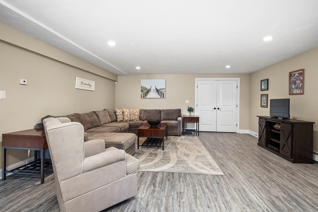57 Wright's Way Marshfield, MA 02050 - Photo 22 of 35 a living room with furniture and a flat screen tv