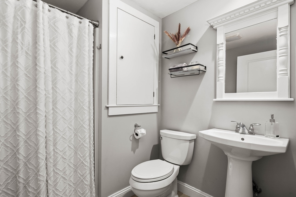 57 Wright's Way Marshfield, MA 02050 - Photo 25 of 35 a bathroom with a sink a toilet and shower