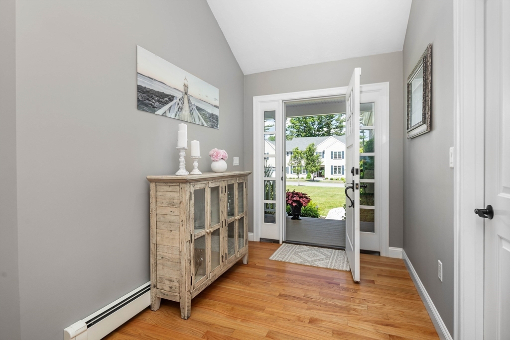 57 Wright's Way Marshfield, MA 02050 - Photo 4 of 35 a view of an entryway with wooden floor and windows