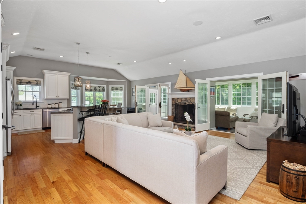 57 Wright's Way Marshfield, MA 02050 - Photo 6 of 35 a living room with furniture a fireplace and a kitchen view