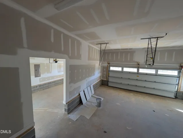 a view of room with stairs and mirrors