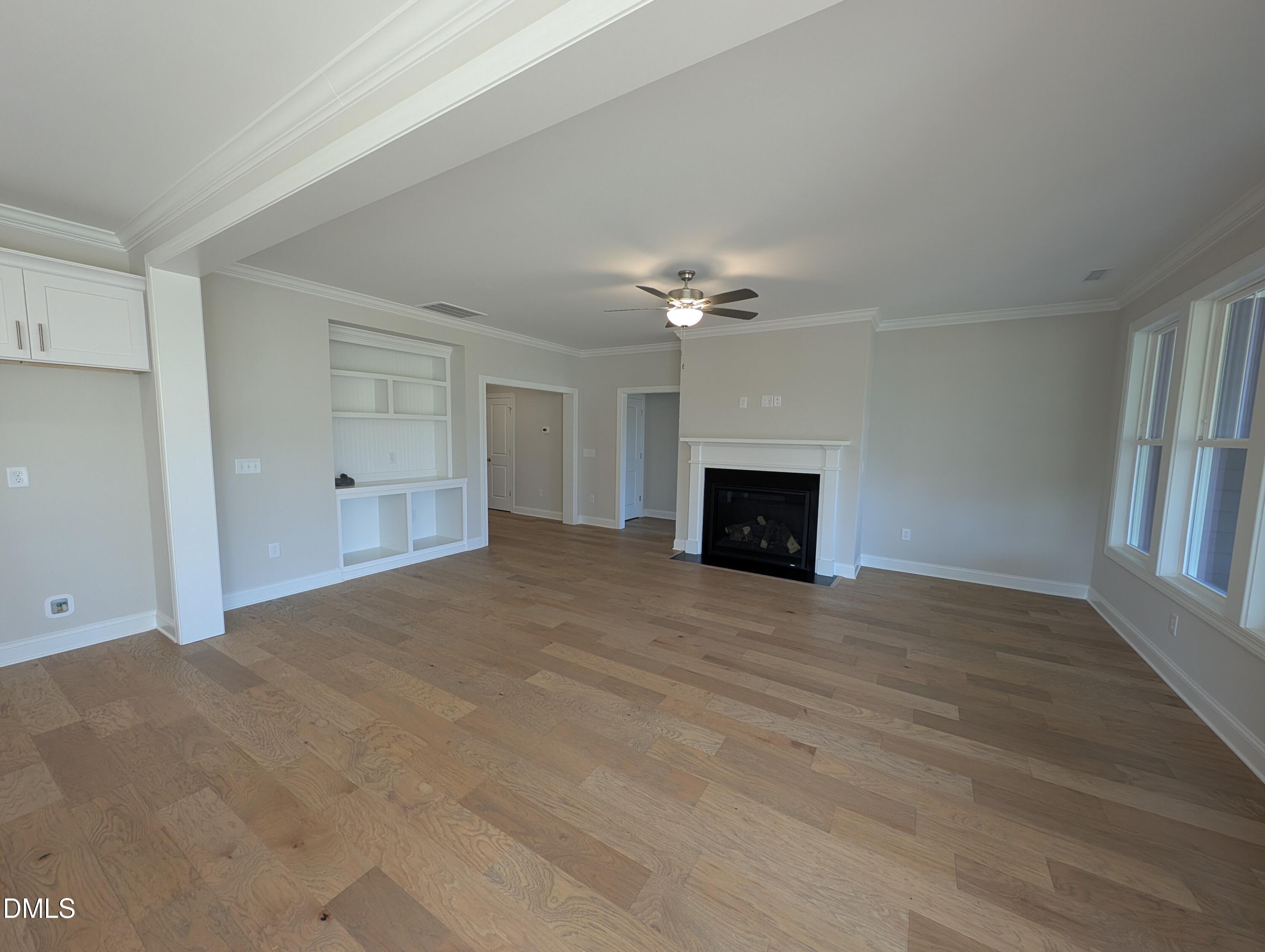 2830 John Lewis Road Burlington, NC 27217 - Photo 24 of 55 a view of empty room with fireplace and wooden floor