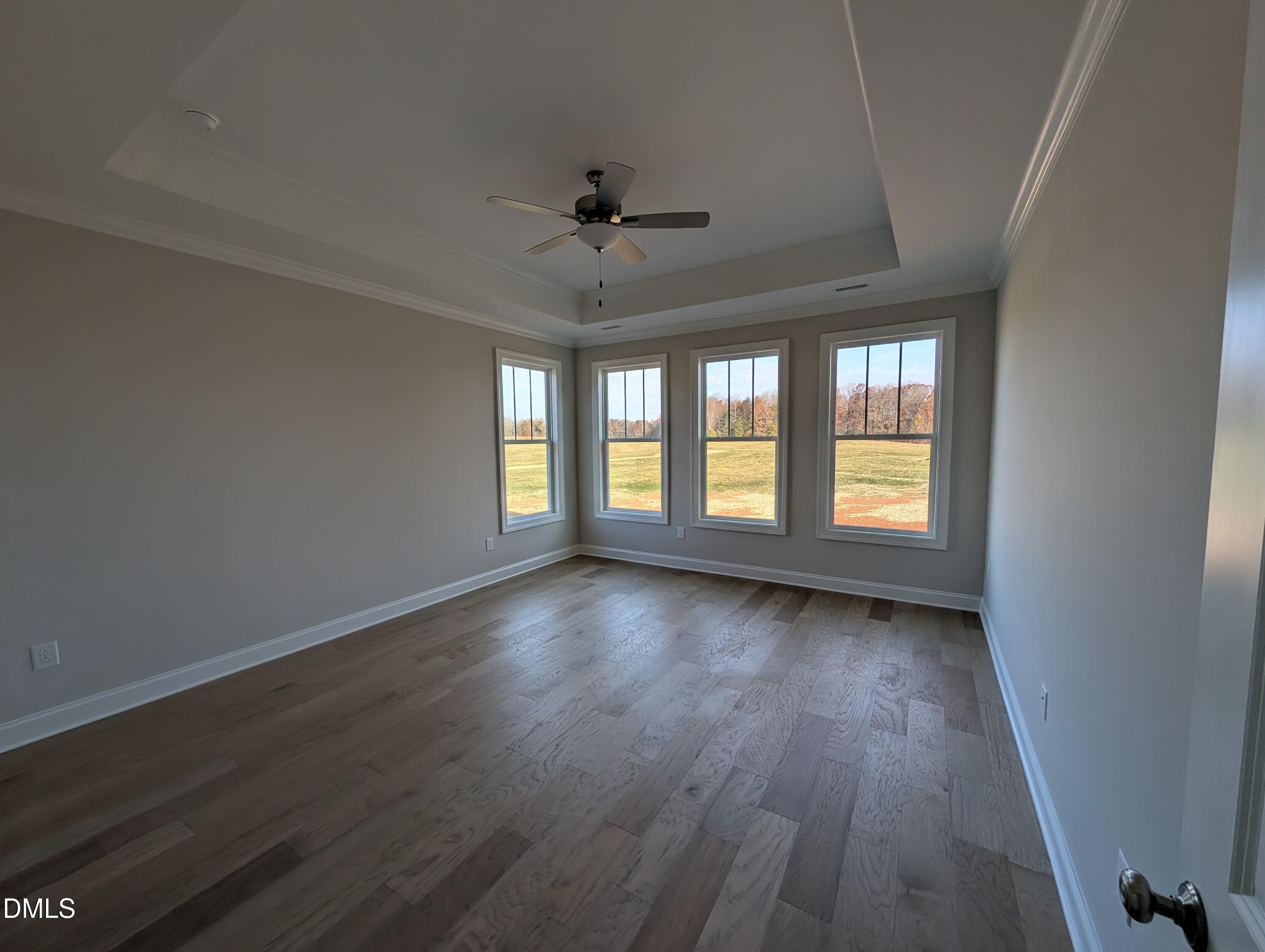 2830 John Lewis Road Burlington, NC 27217 - Photo 26 of 55 wooden floor in an empty room with a window