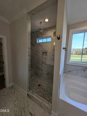 a bathroom with a shower and a sink