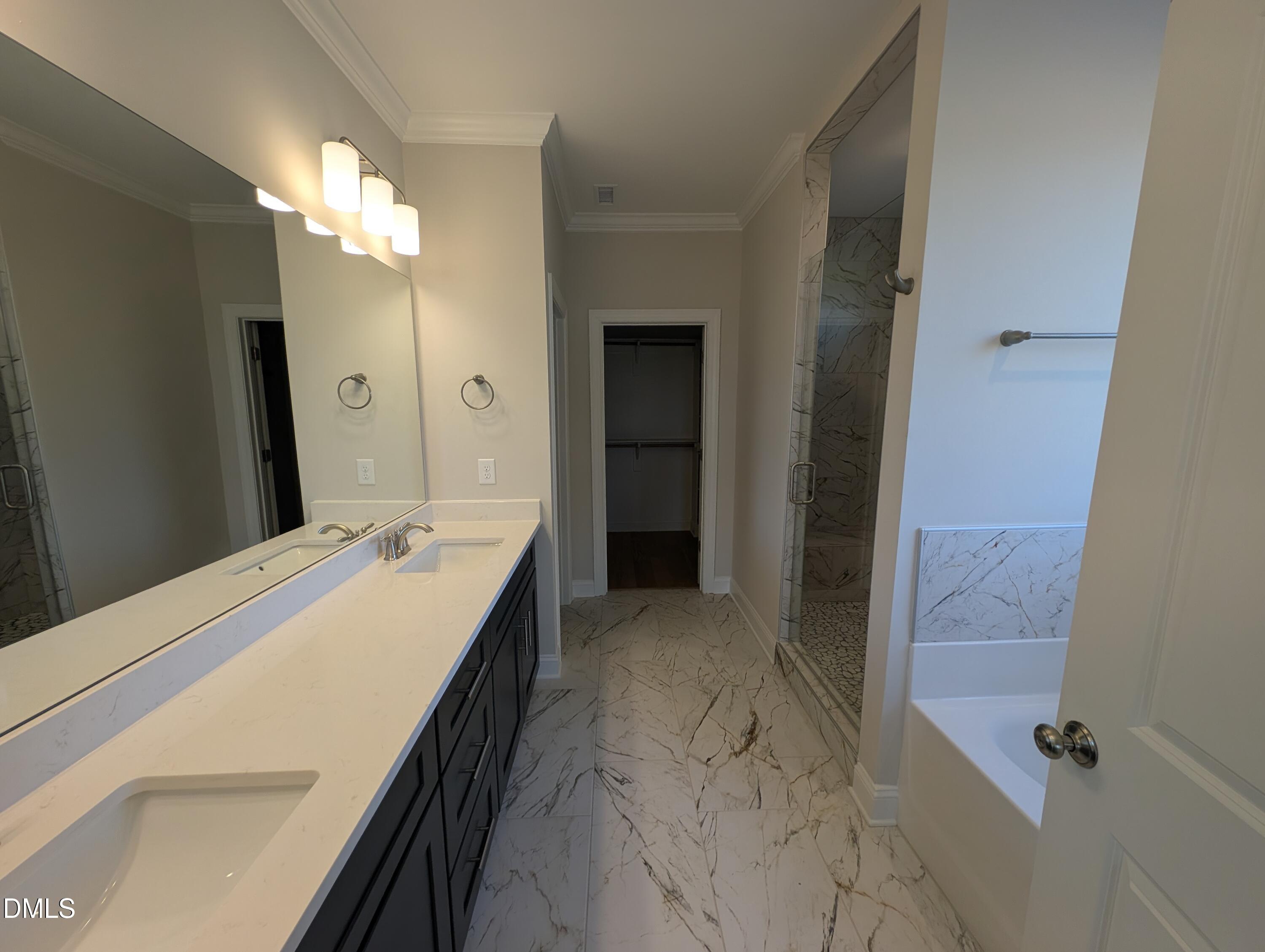 2830 John Lewis Road Burlington, NC 27217 - Photo 35 of 55 a bathroom with a double vanity sink and mirror
