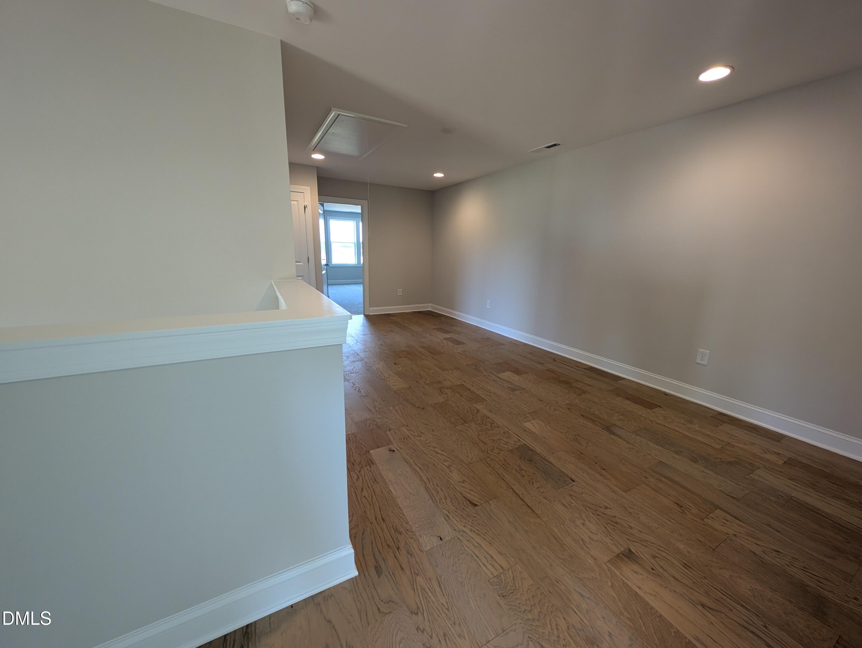 2830 John Lewis Road Burlington, NC 27217 - Photo 37 of 55 an empty room with wooden floor and windows