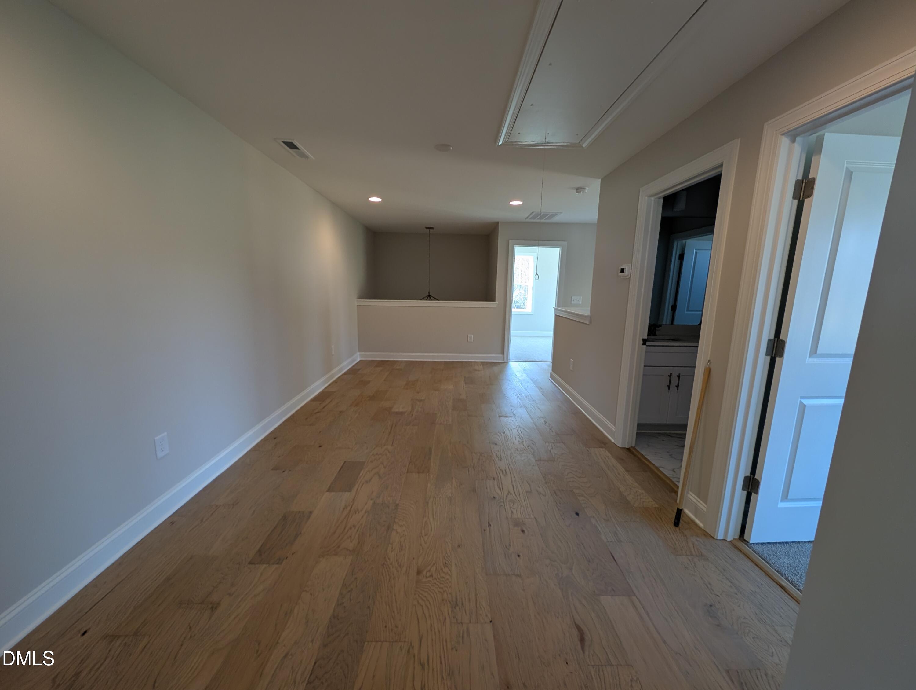 2830 John Lewis Road Burlington, NC 27217 - Photo 47 of 55 a view of a hallway with wooden floor