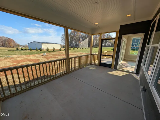 a view of an empty room with a large window