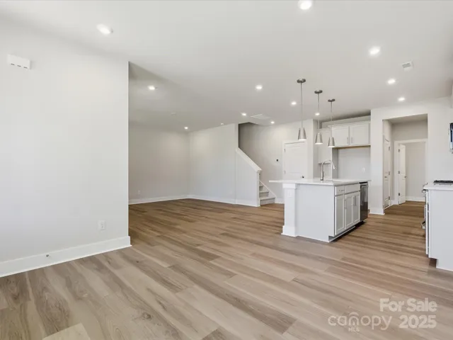 a view of kitchen and kitchen with wooden floor