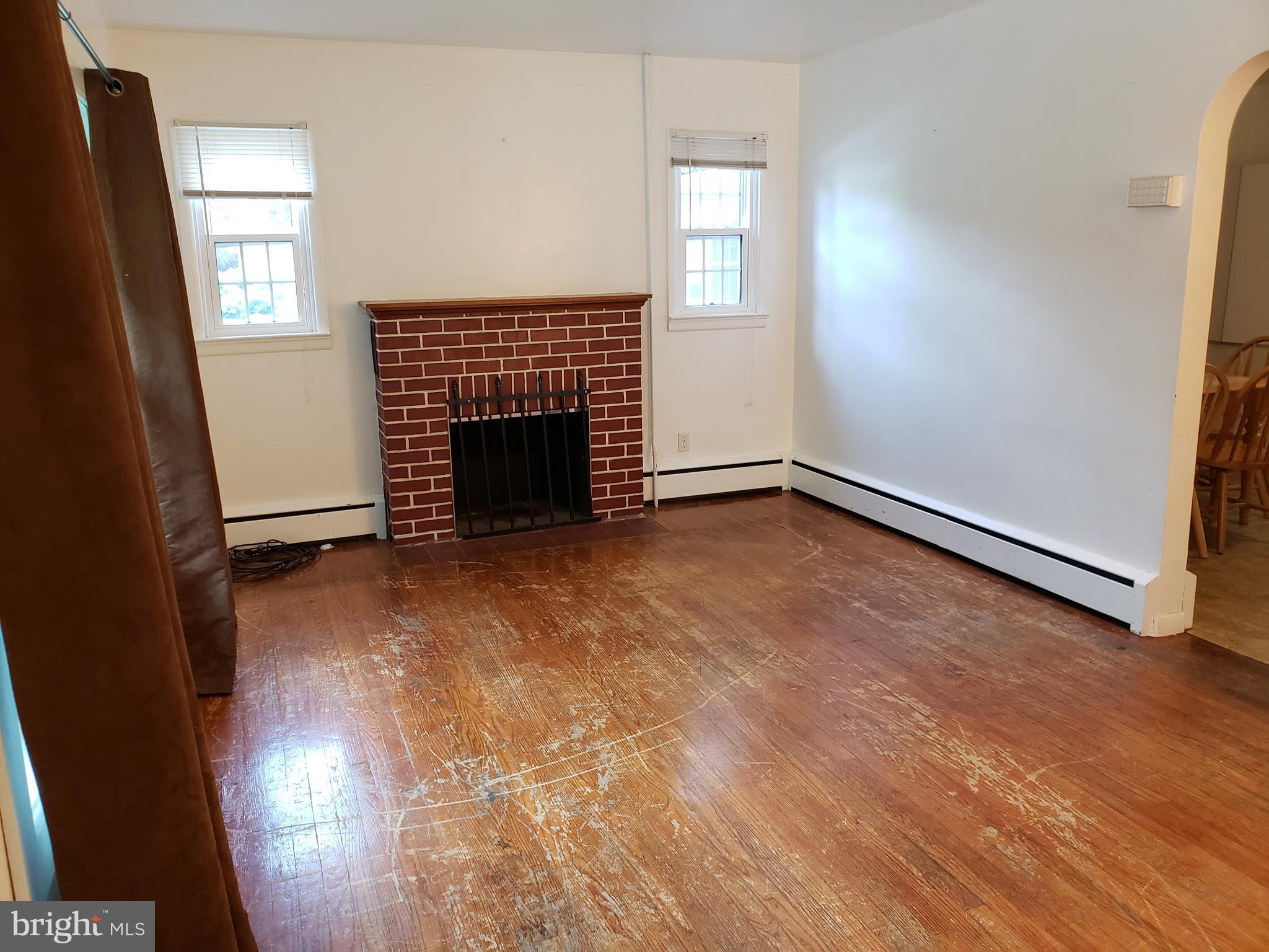 101 Green Lane Trenton, NJ 08638 - Photo 3 of 21 Living Room w hw floors and fireplace