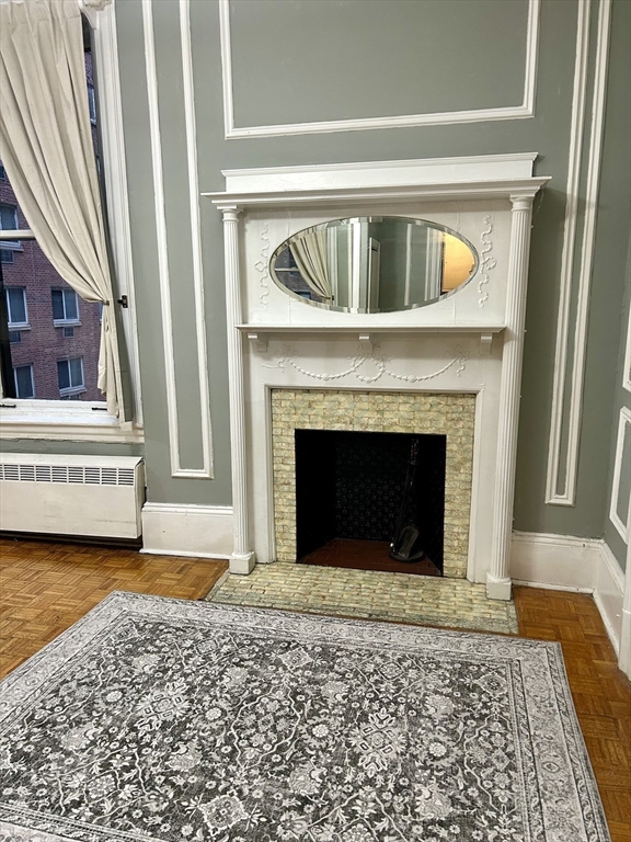 21 Beacon Street, Unit 4Q Boston, MA 02108 - Photo 3 of 10 a view of a livingroom with a fireplace