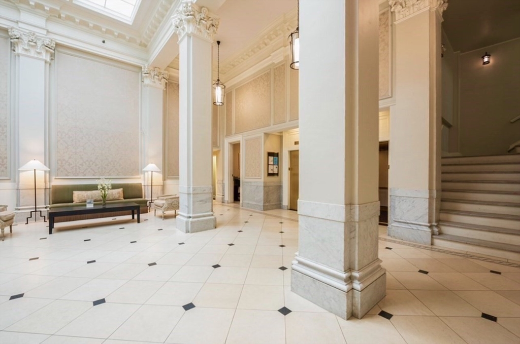 21 Beacon Street, Unit 4Q Boston, MA 02108 - Photo 7 of 10 a view of kitchen with granite countertop cabinets and refrigerator