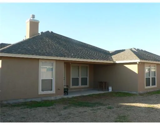 a house that has a tree in front of it