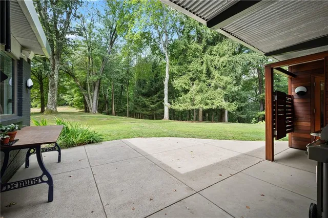 a view of a backyard with sitting area