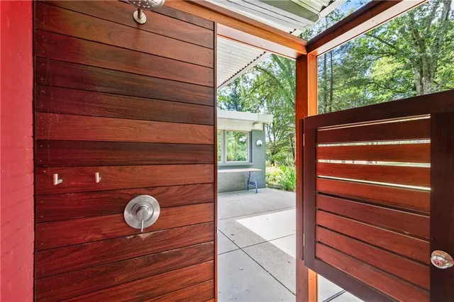 a view of room with a door and a chair