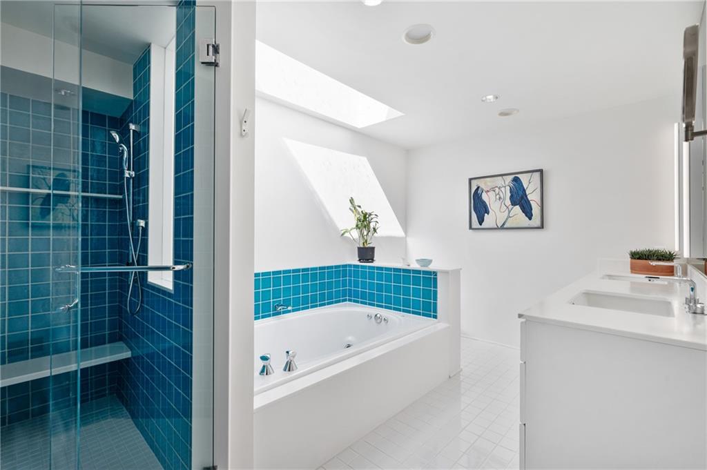 121 Hidden Ridge Pittsburgh, PA 15238 - Photo 23 of 48 a bathroom with a bathtub a sink and a shower