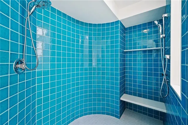 a bathroom with a toilet sink and shower