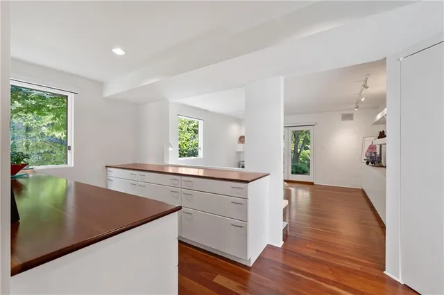 a view with cabinets and wooden floor