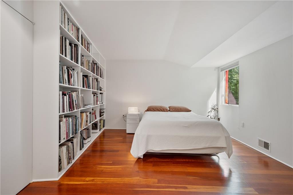 121 Hidden Ridge Pittsburgh, PA 15238 - Photo 27 of 48 a bedroom with a bed and a book shelf