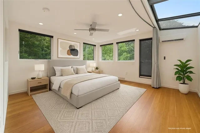 a view of a house with a yard balcony and sitting area