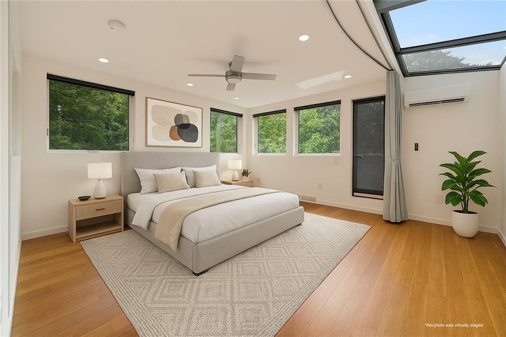 121 Hidden Ridge Pittsburgh, PA 15238 - Photo 32 of 48 a spacious bedroom with a large bed and a potted plant